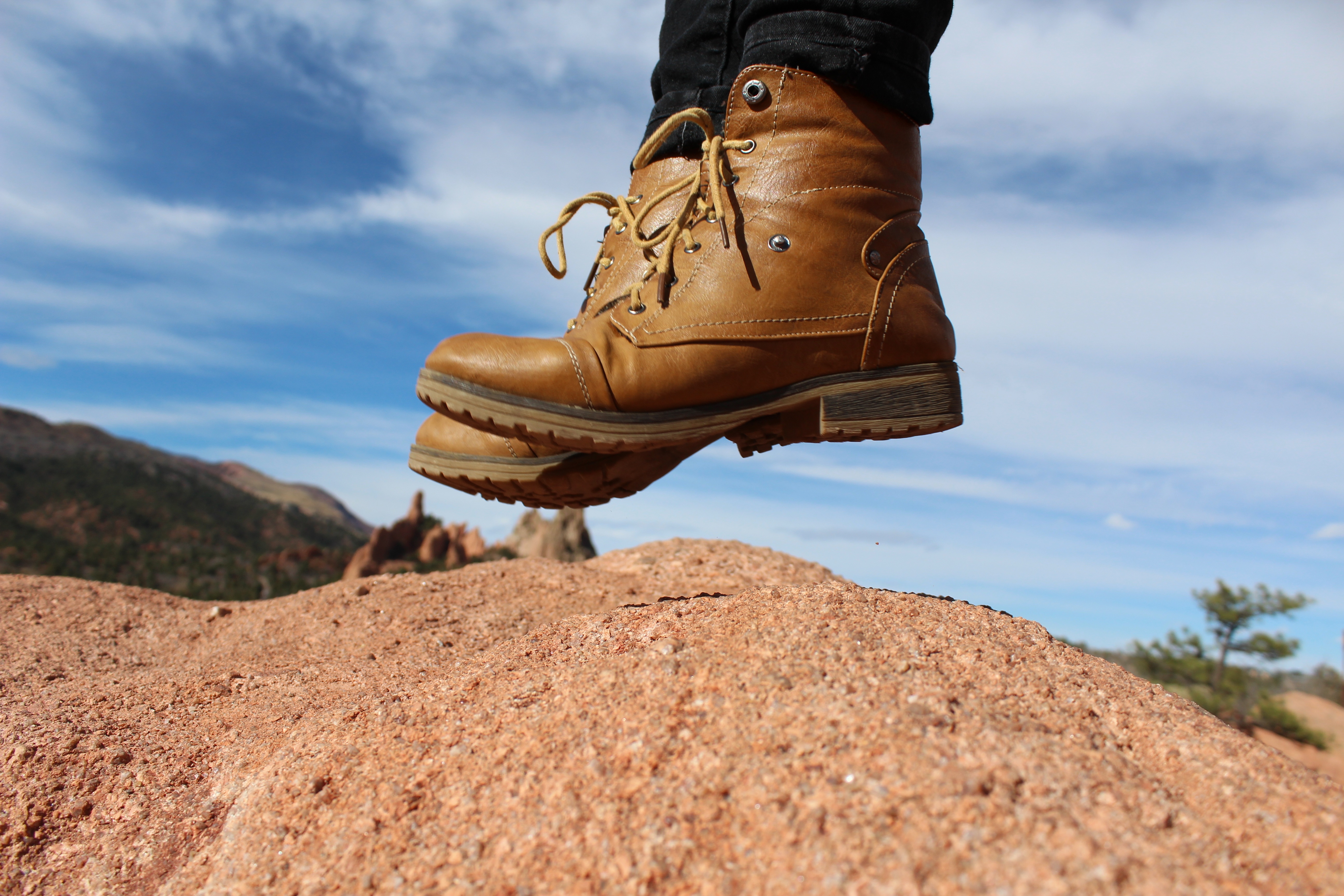person wearing boots jumping